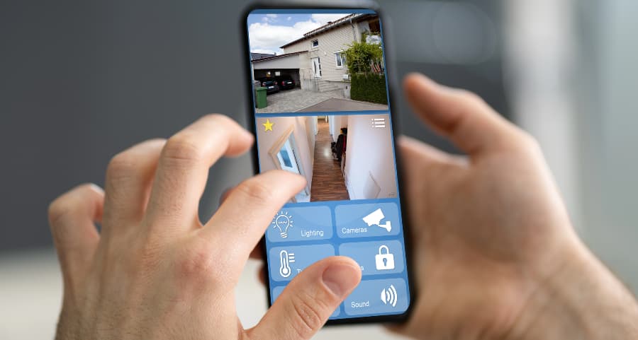 Homeowner looking at video camera footage on a smartphone